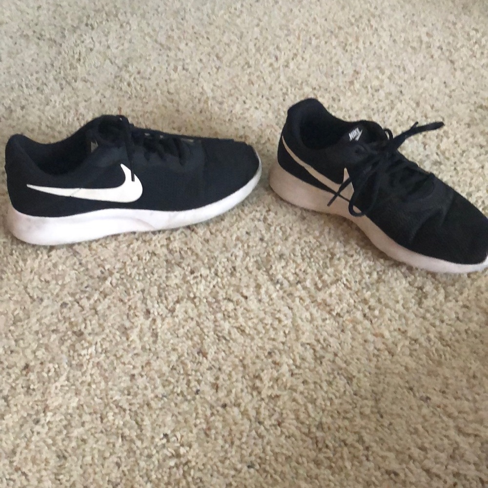 NIKE black with white soles running shoes